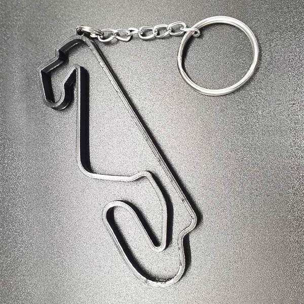 Stylish key ring for motorsport fans, made of durable nylon with key ring, size approx. 8 cm, various racing tracks available.
